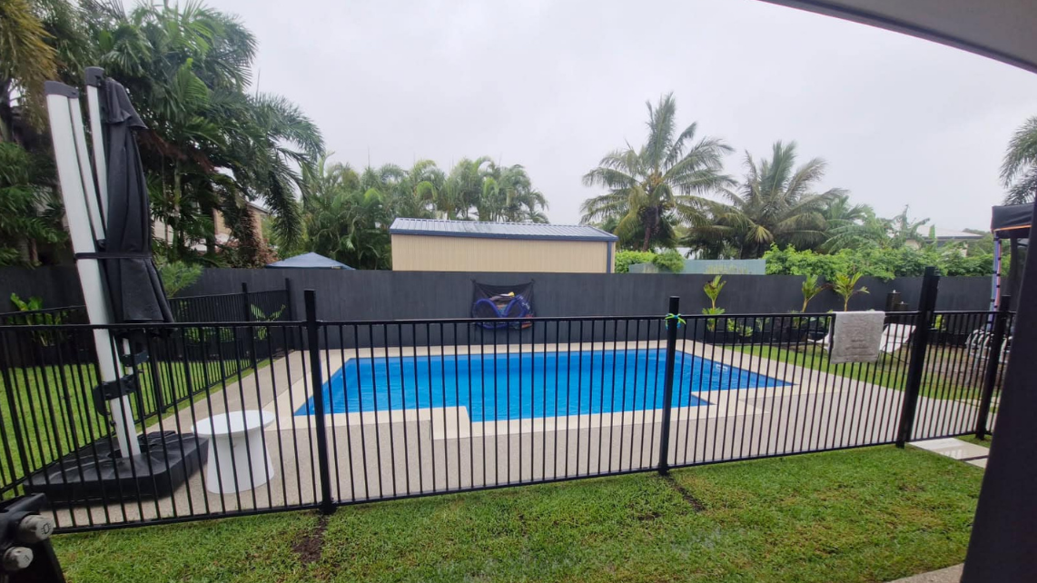 A fully installed fibreglass pool with fence to obey local regulations, taken and installed by Pool Professionals Mackay