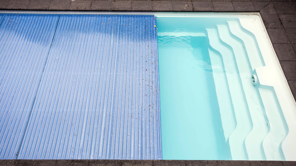 An image of a pool with a pool cover
