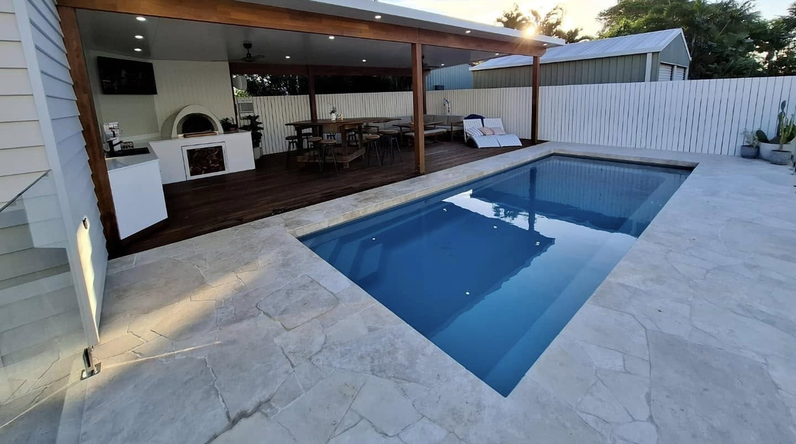 An image of a fibreglass pool with patio, installed and taken by the Pool Professionals Mackay