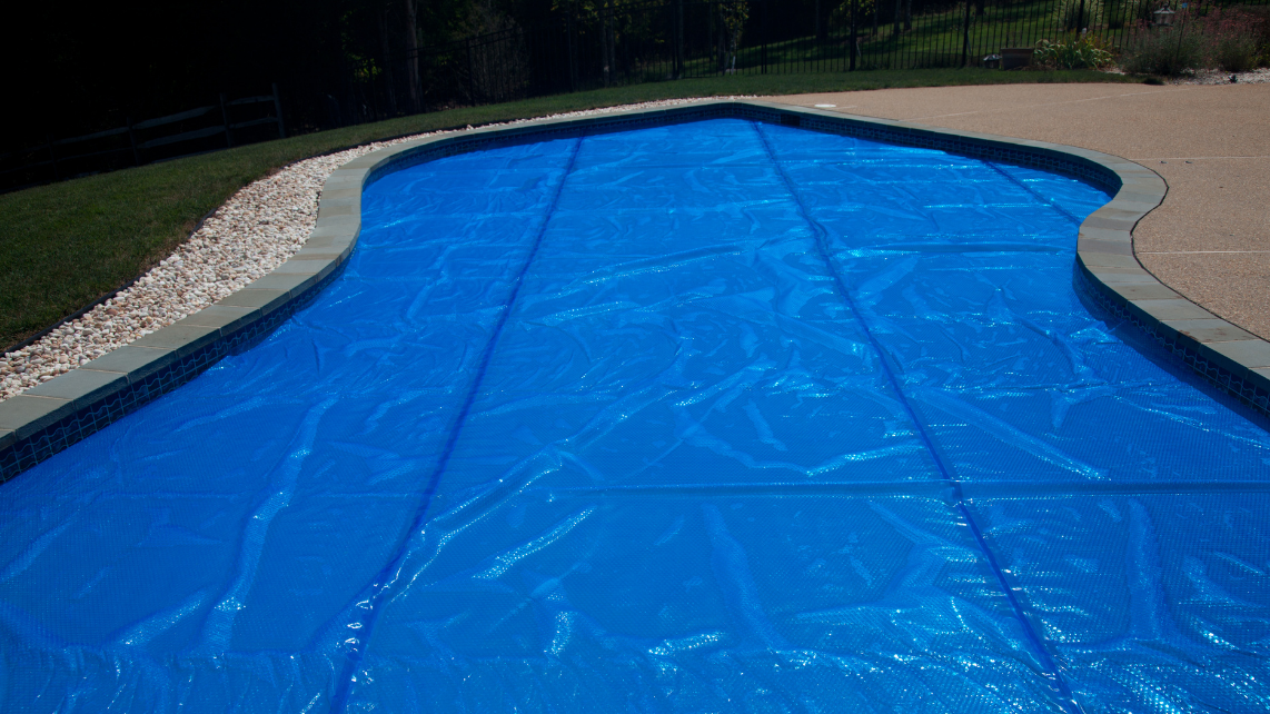 An image of a pool with a solar pool cover
