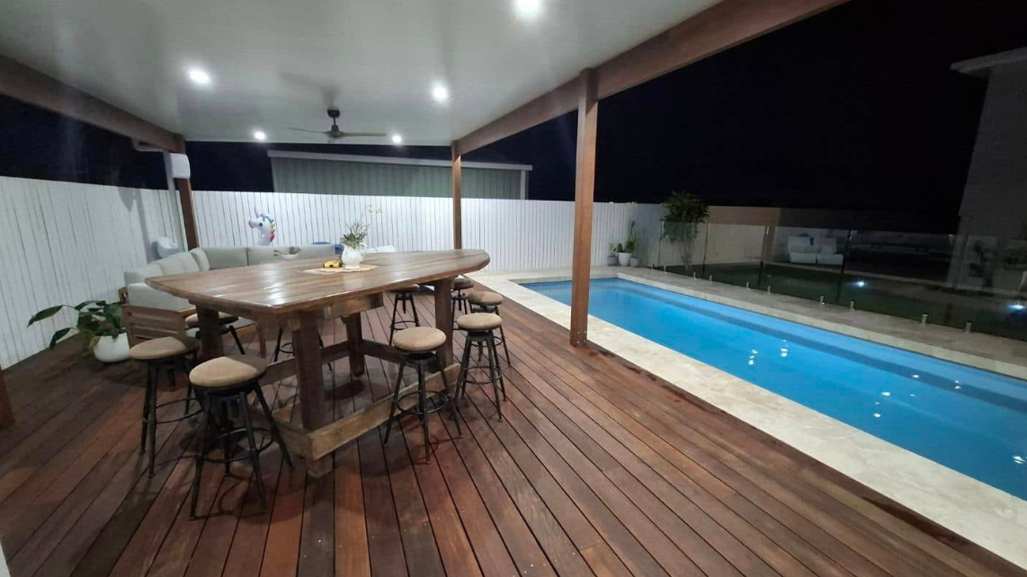 An image of a fibreglass pool at night, installed and taken by Pool Professionals Mackay