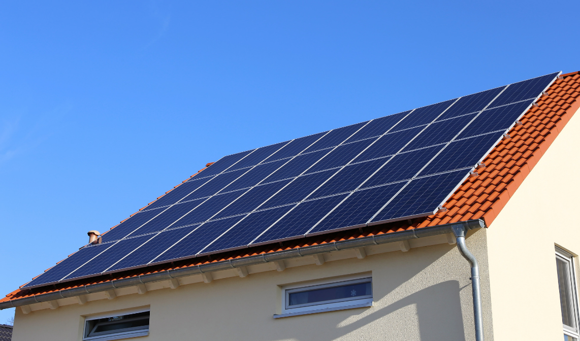 A house that has solar panels on the roof