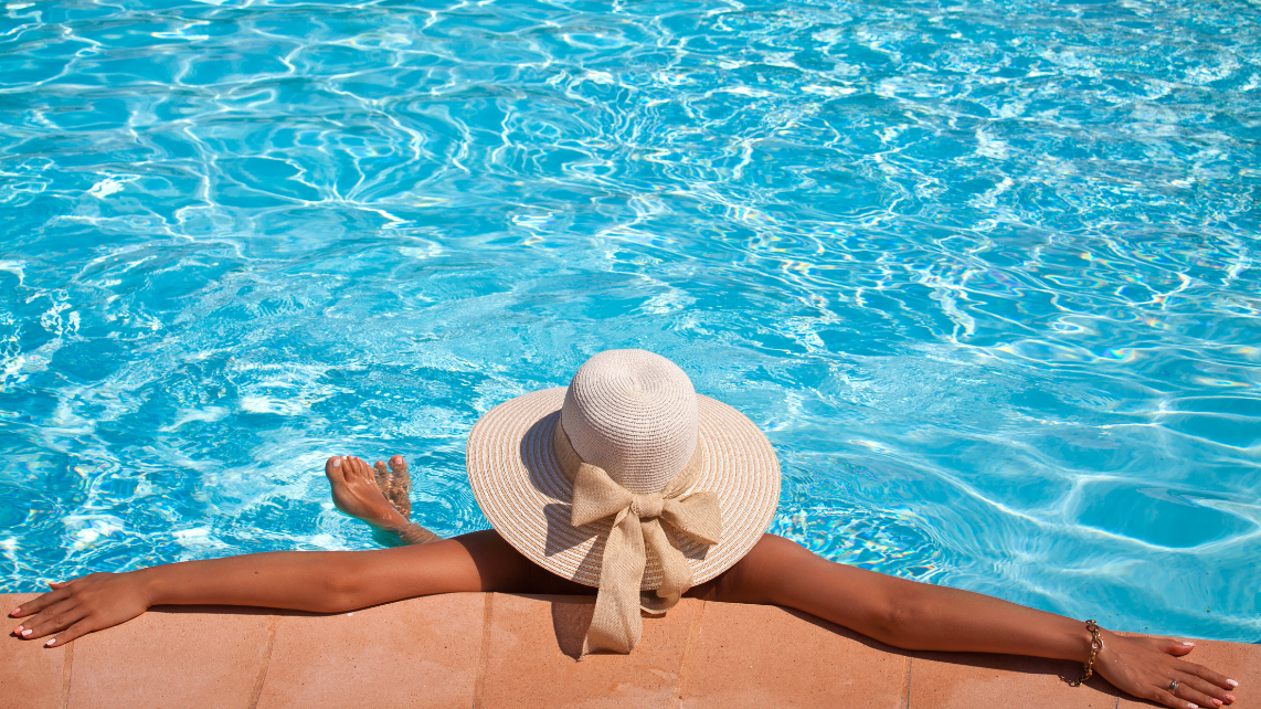 A woman enjoying the pool on a hot day